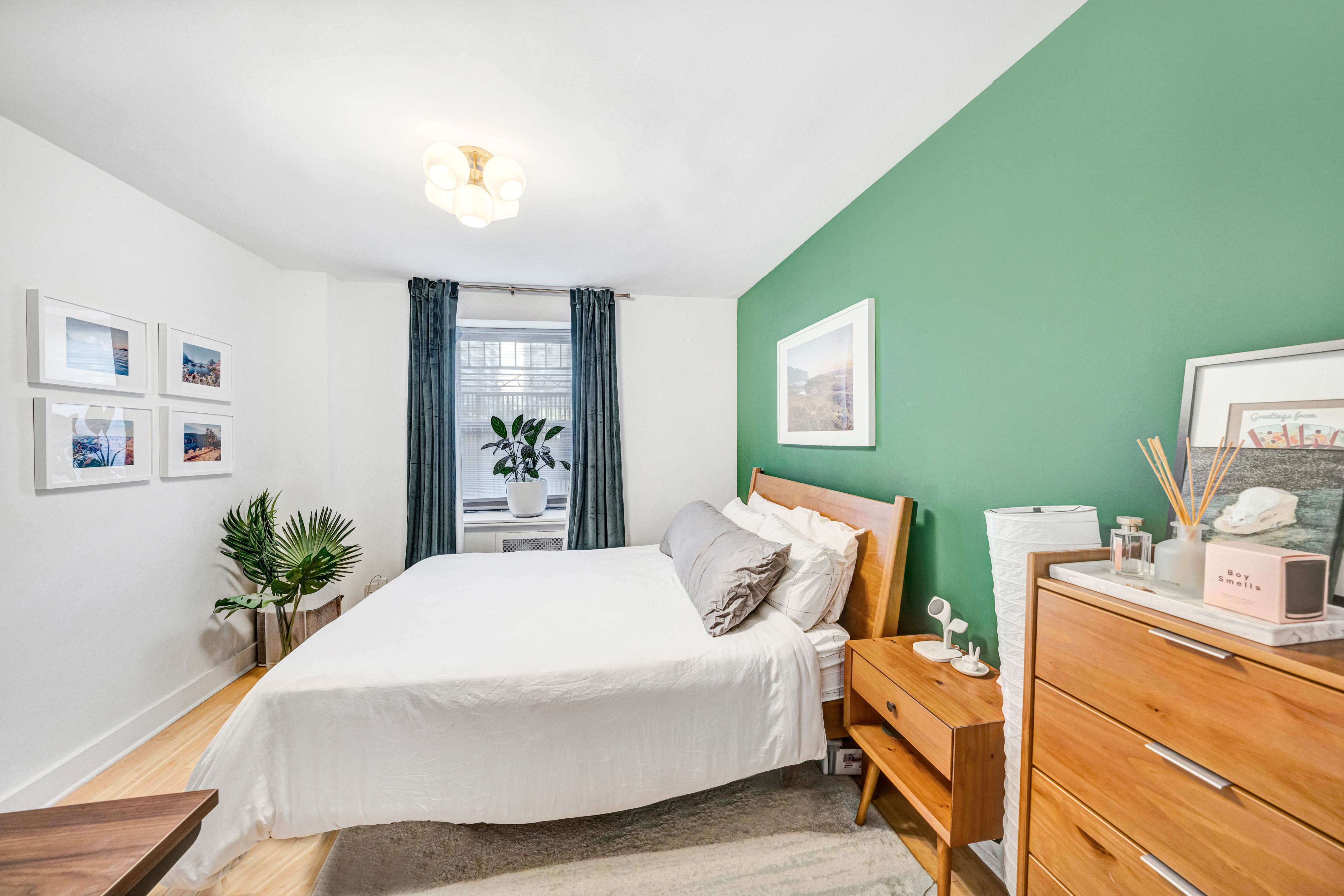 166 West 94th Street, Unit 1 Manhattan, NY 10025 - Photo 6 of 10 a bedroom with a bed and wooden floor