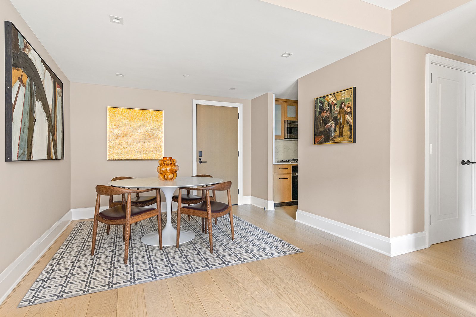 210 Warren Street, Unit 10G Manhattan, NY 10282 - Photo 3 of 15 a dining room with wooden floor and window