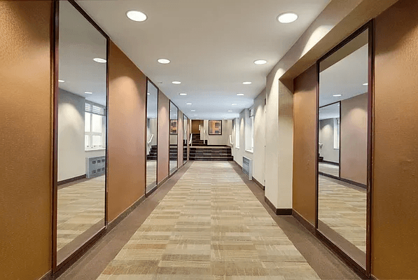 13 West 13th Street, Unit 2DS Manhattan, NY 10011 - Photo 15 of 19 a view of a hallway with a couch and wooden floor