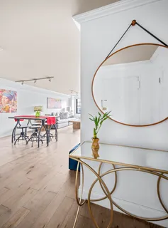 a view of a livingroom with furniture and a table