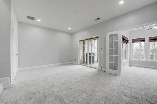 a view of an empty room with a balcony
