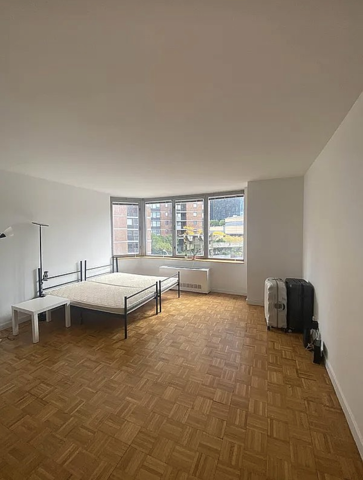 500 West 43rd Street, Unit 4E Manhattan, NY 10036 - Photo 2 of 11 a living room with furniture and a window