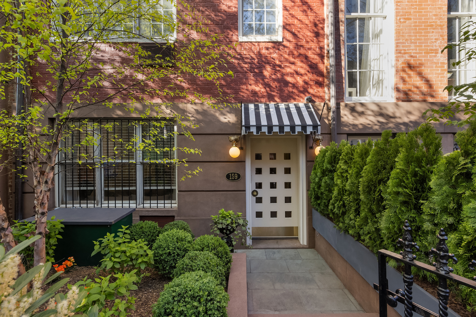 159 West 13th Street Manhattan, NY 10011 - Photo 2 of 36 front view of a house with a large window