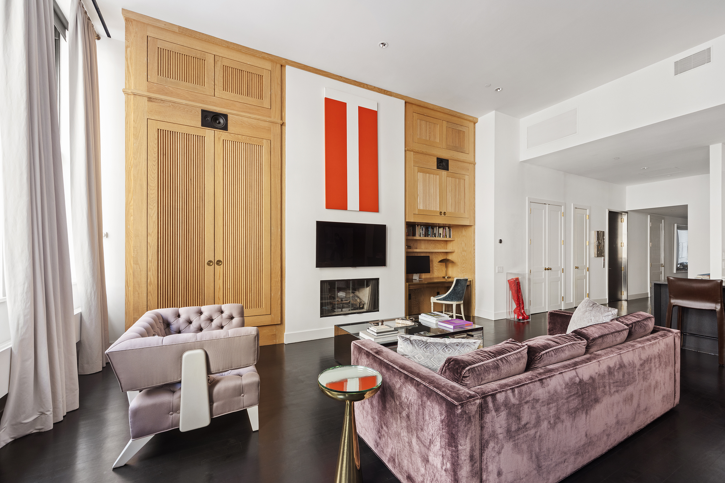 109 Greene Street, Unit 2C Manhattan, NY 10012 - Photo 2 of 13 a living room with furniture and flat screen tv