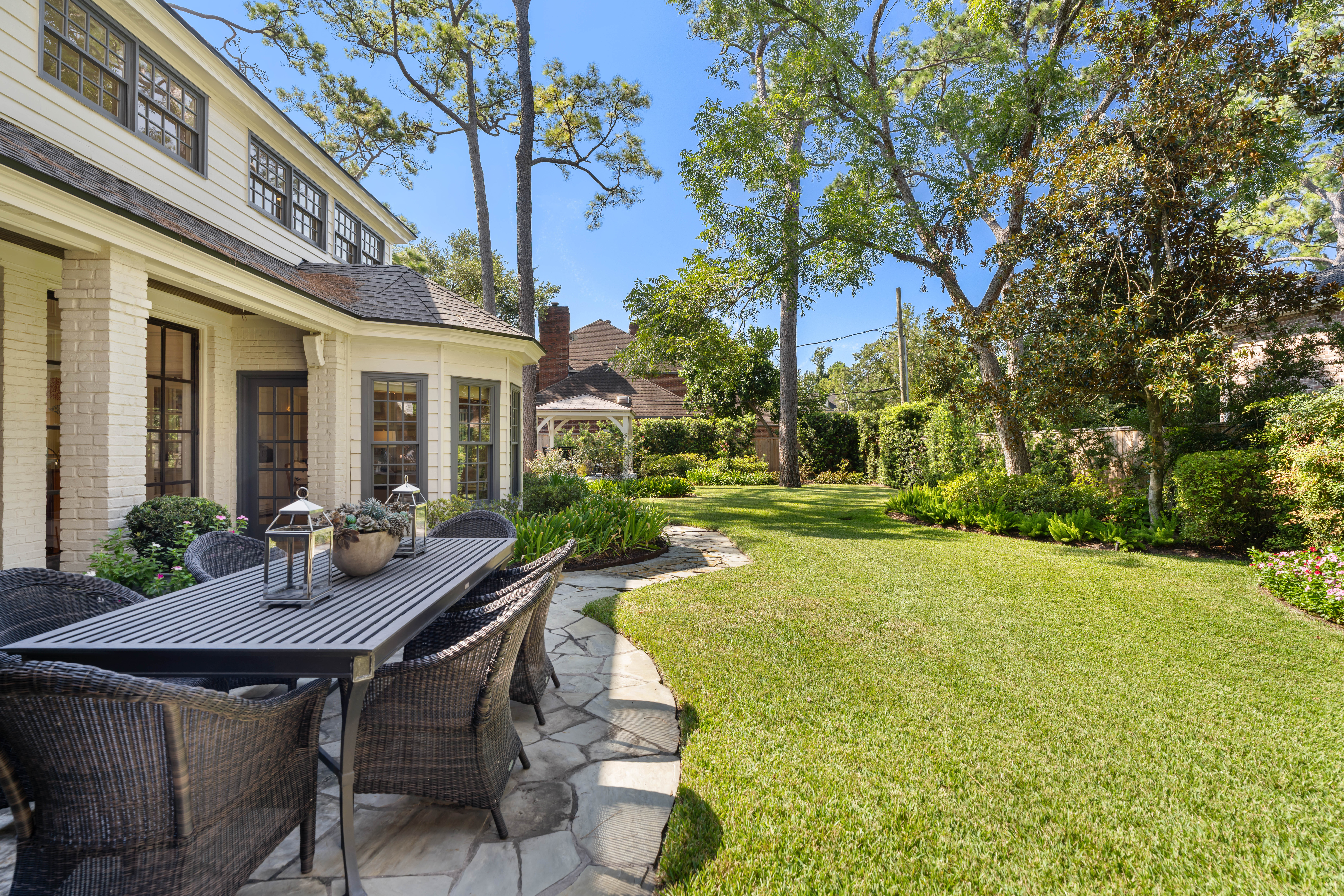 711 Pifer Road Houston, TX 77024 - Photo 5 of 53 a view of a patio with table and chairs and potted plants