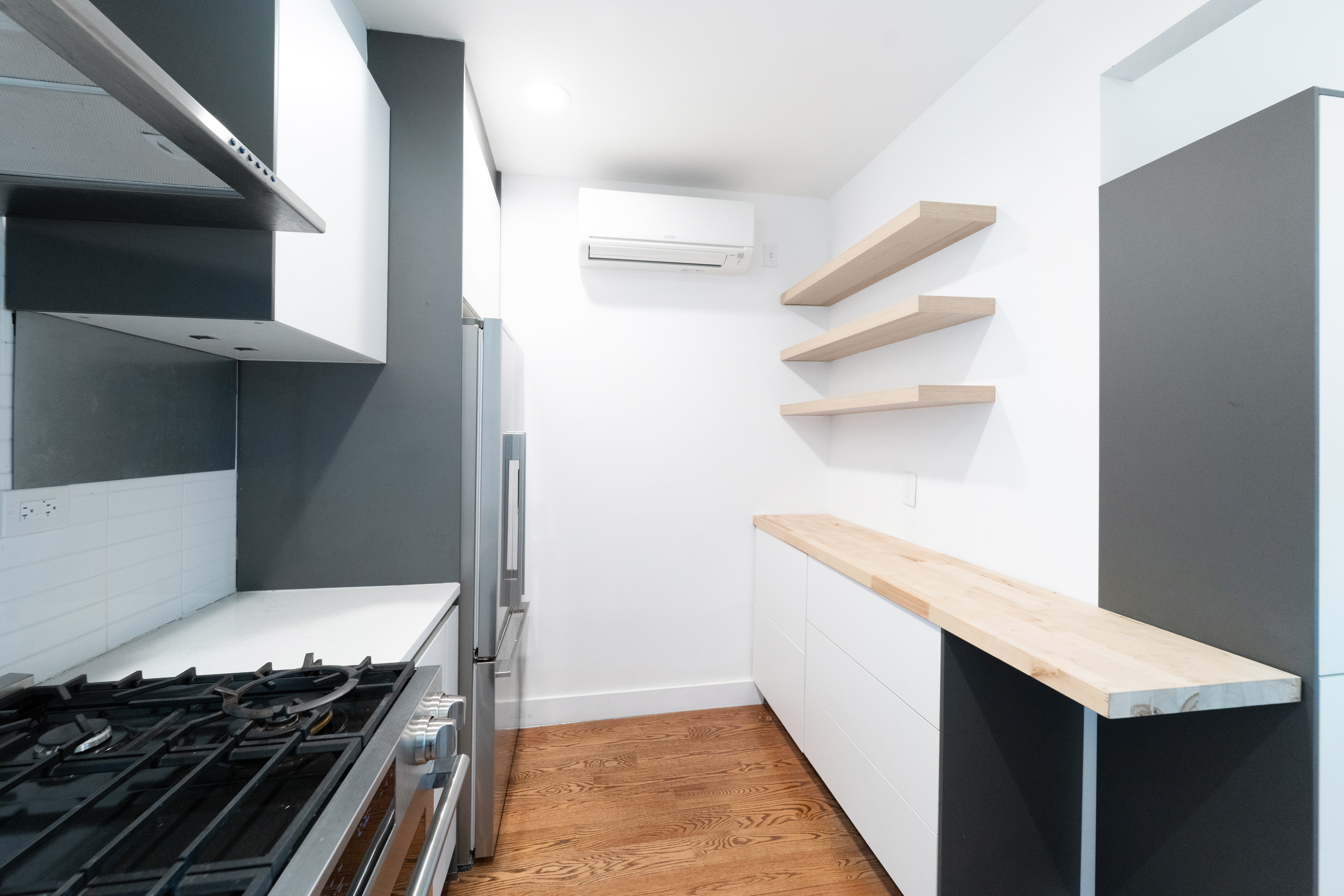 299 Van Buren Street, Unit 4C Brooklyn, NY 11221 - Photo 10 of 16 a kitchen view of a refrigerator and a stove