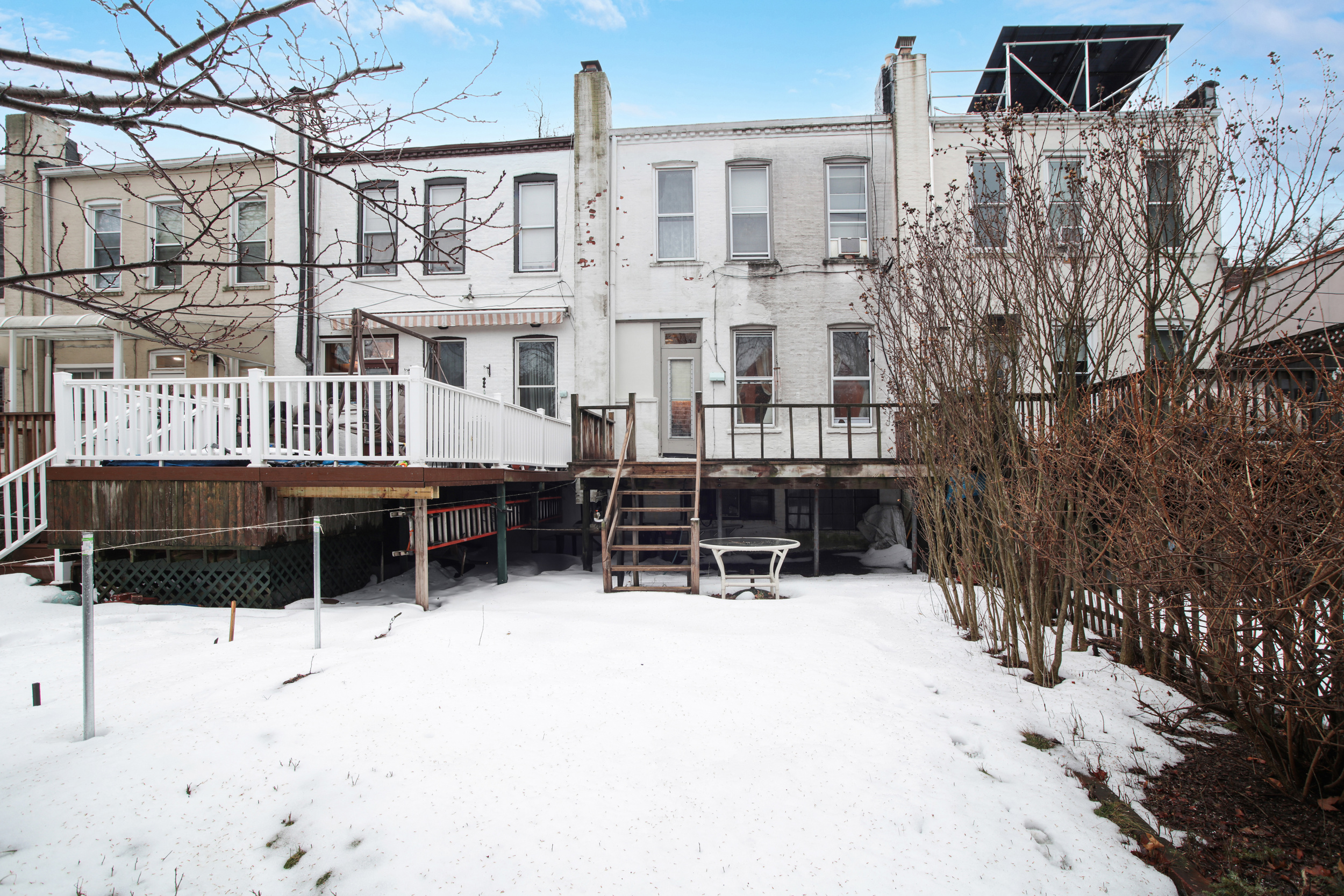 425 81st Street Brooklyn, NY 11209 - Photo 12 of 13 a backyard of a house with table and chairs