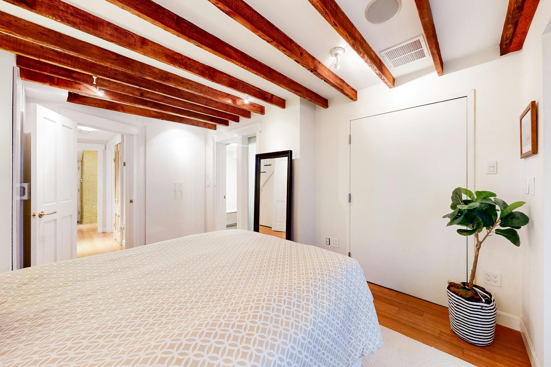 11 Fayette Street, Unit 1 Boston, MA 02116 - Photo 19 of 33 a bedroom with a bed and a potted plant