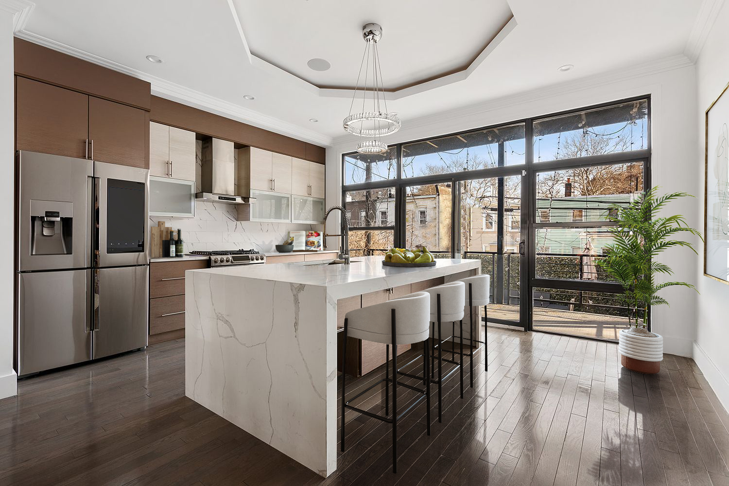 456 Decatur Street, Unit 1 Brooklyn, NY 11233 - Photo 2 of 6 a kitchen with stainless steel appliances granite countertop a stove top oven a refrigerator a dining table and chairs with wooden floor