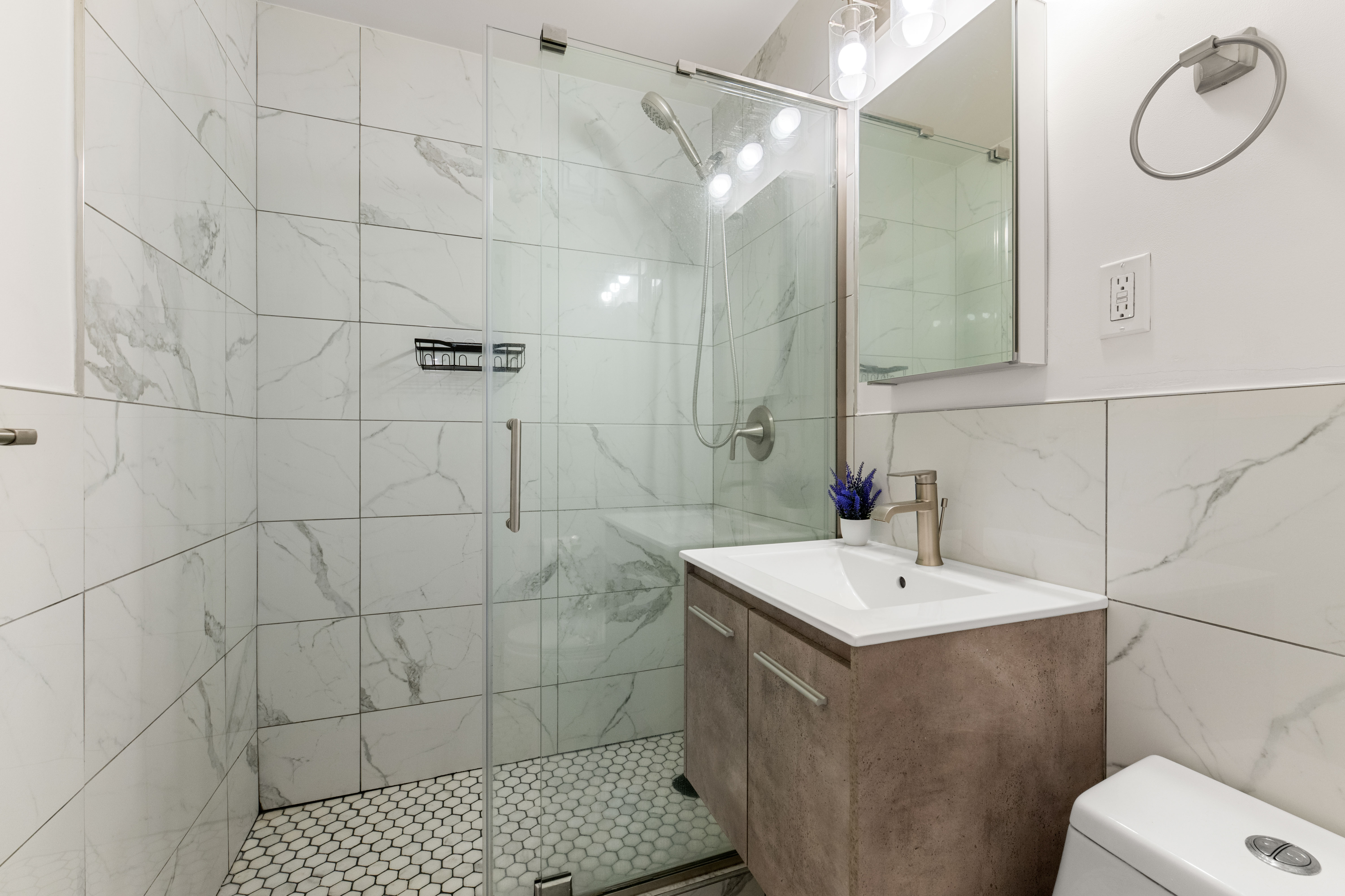 66-36 Yellowstone Boulevard, Unit 24A Queens, NY 11375 - Photo 8 of 20 a bathroom with a sink toilet and shower