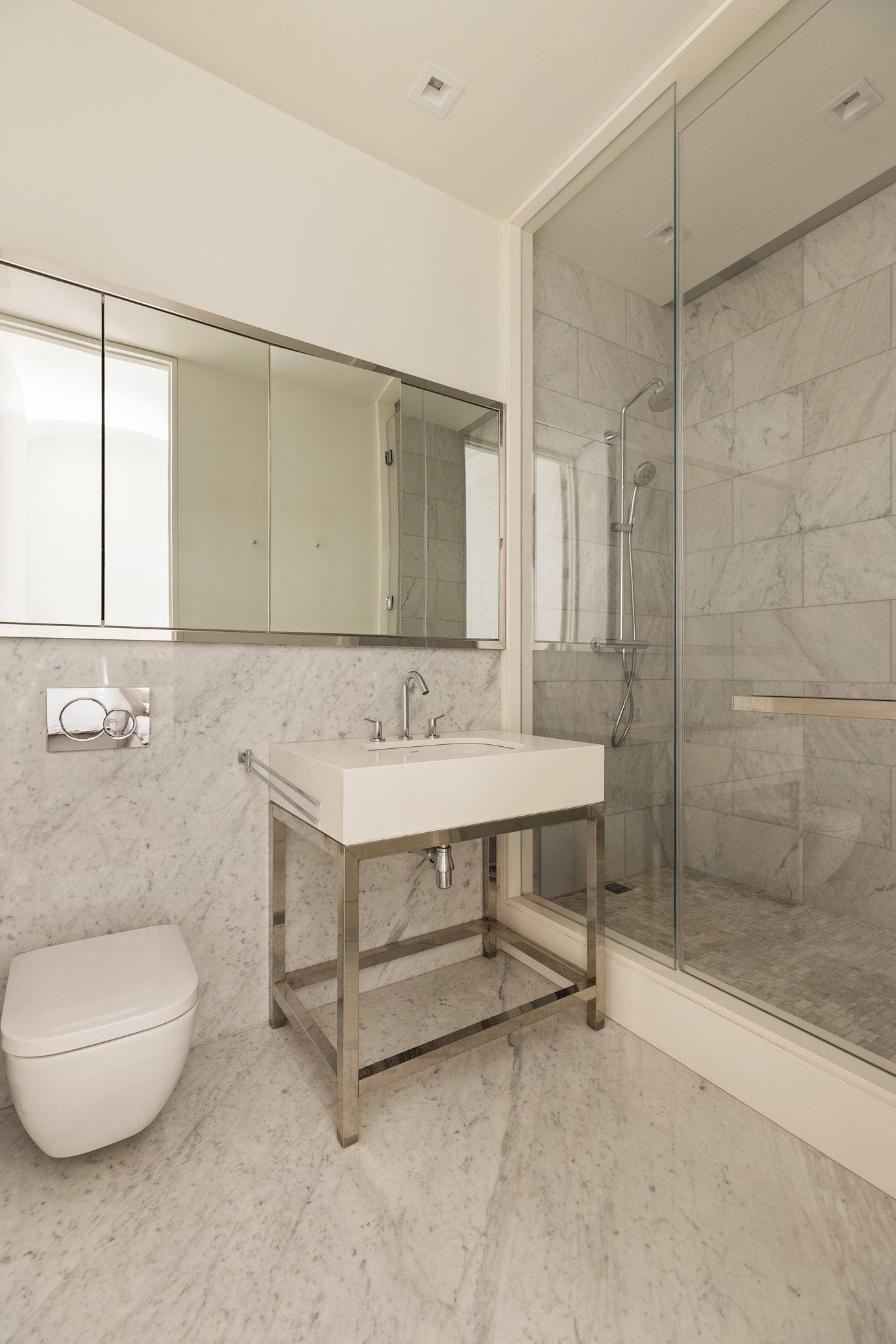 543 Broadway, Unit 6 Manhattan, NY 10012 - Photo 10 of 13 a bathroom with a sink and a mirror