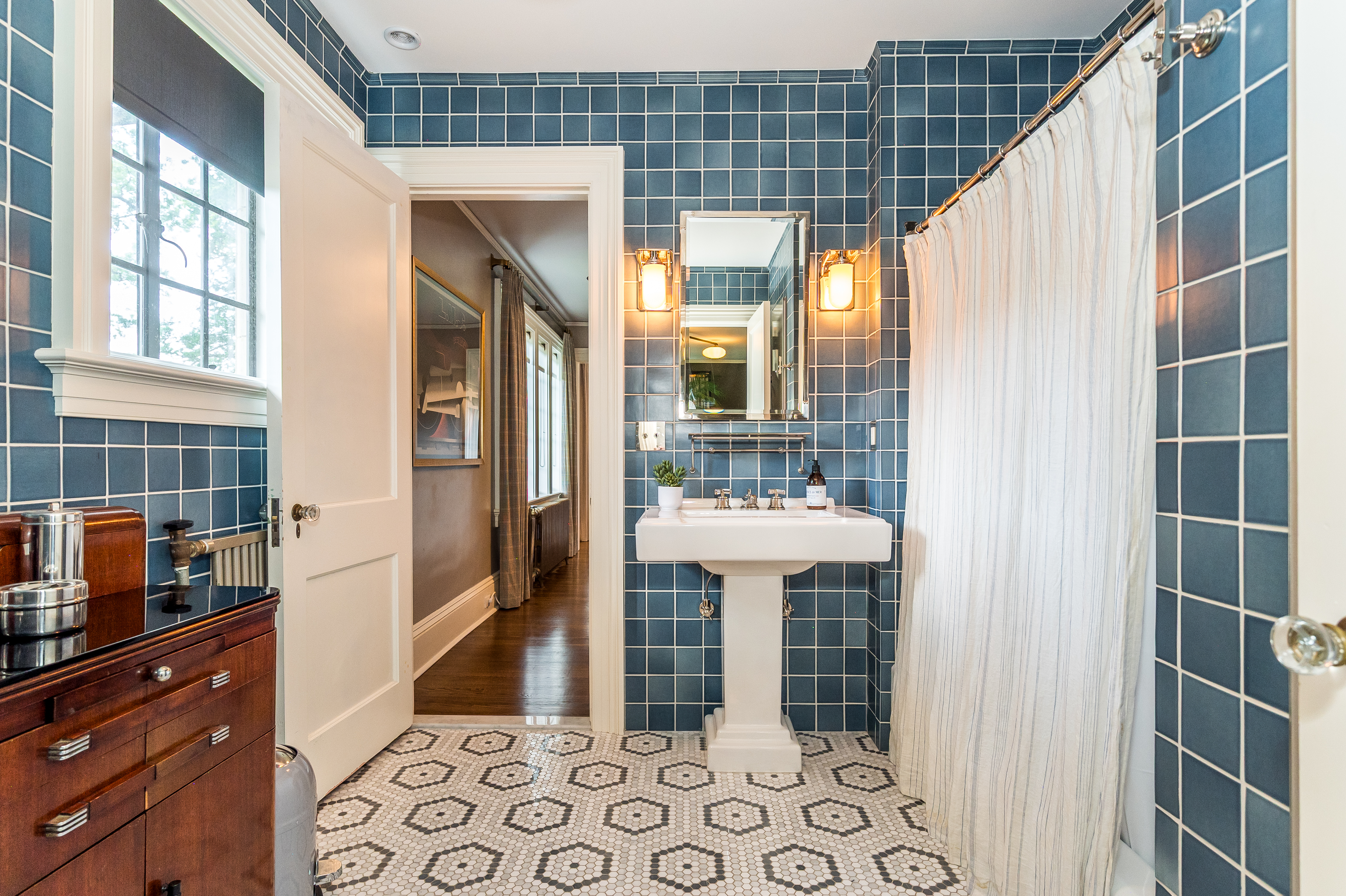 85 Clinton Avenue Montclair, NJ 07042 - Photo 46 of 65 a bathroom with a sink and mirror