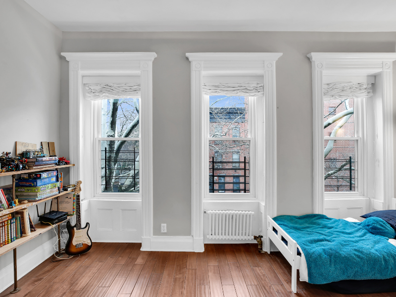 1124 Prospect Place, Unit PLEX Brooklyn, NY 11213 - Photo 12 of 15 a bedroom with a bed and a window