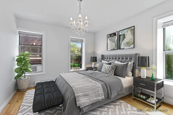 a bedroom with bed and a window