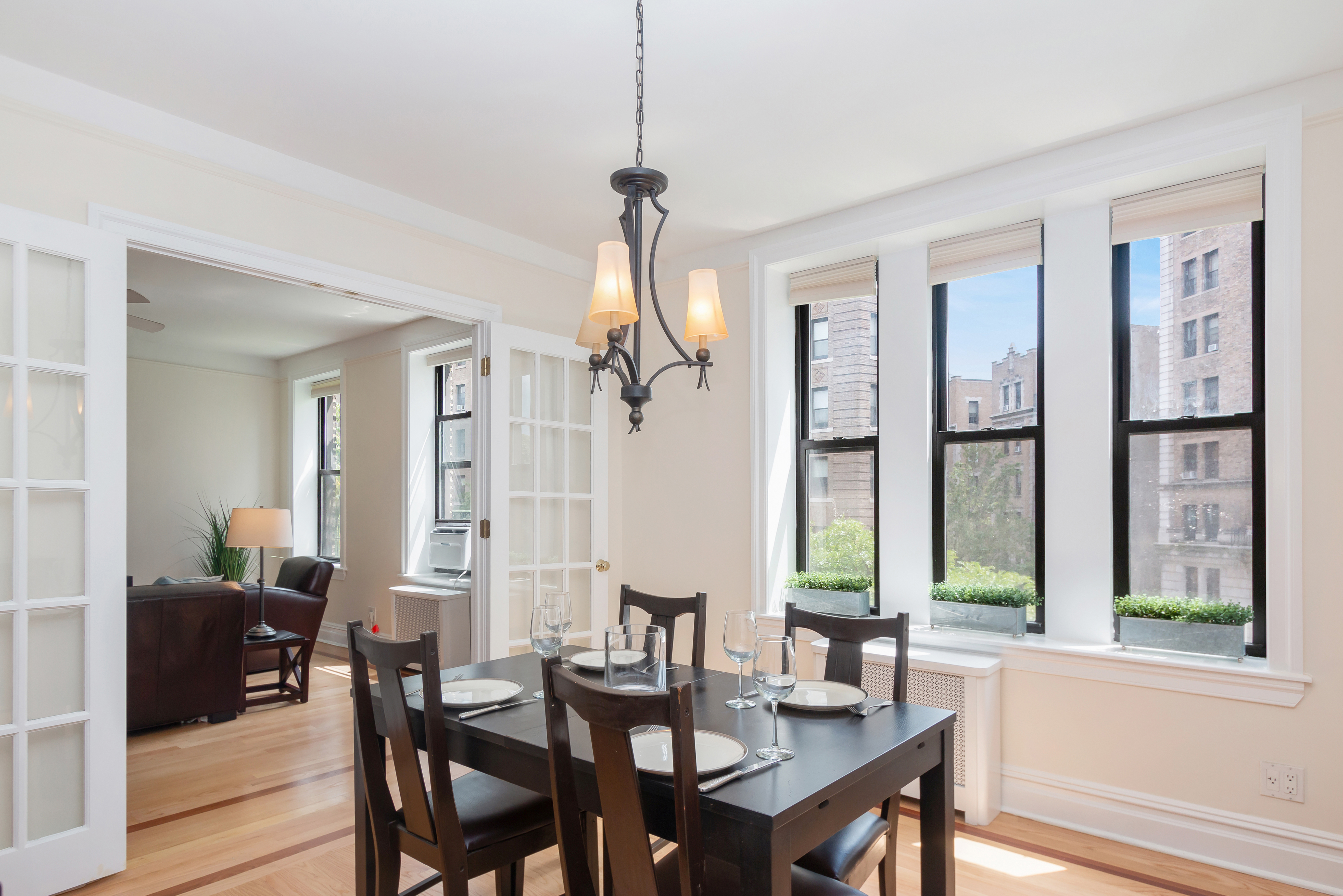 801 Riverside Drive, Unit 4F Manhattan, NY 10032 - Photo 1 of 13 a view of a a dining room with furniture window and wooden floor