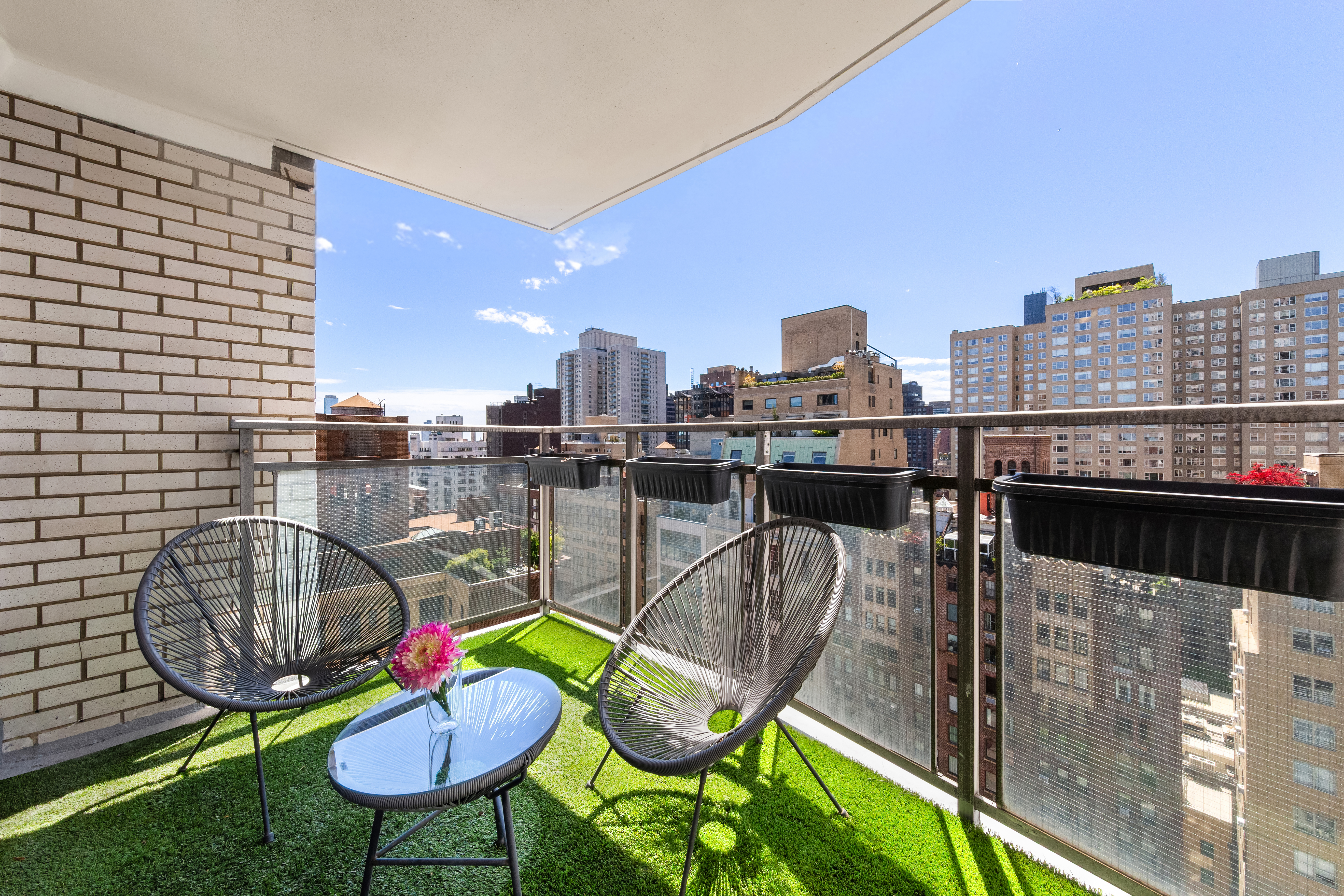 303 East 57th Street, Unit 20LA Manhattan, NY 10022 - Photo 3 of 18 a view of a balcony with chairs