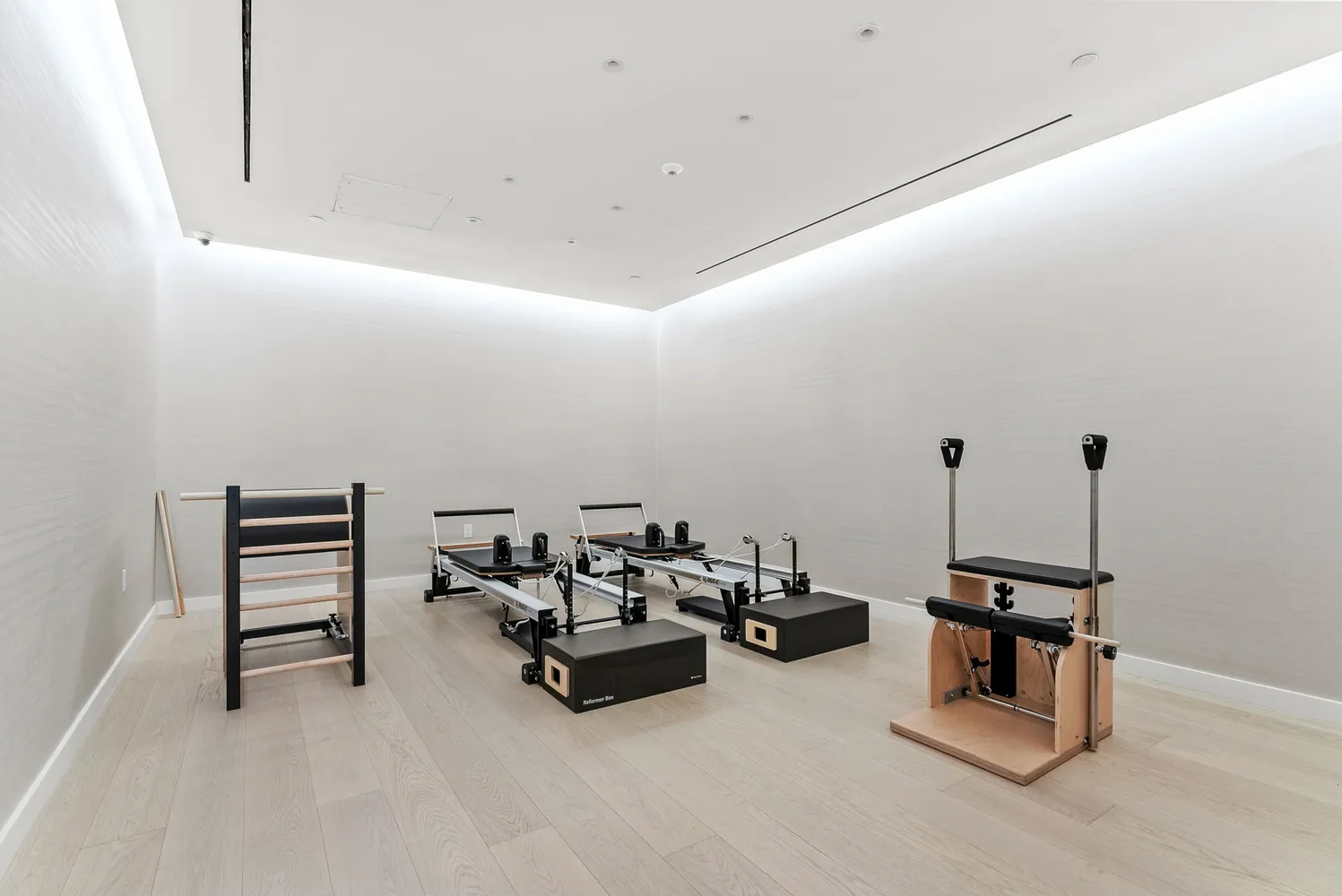 a living room with furniture and a air conditioner vent