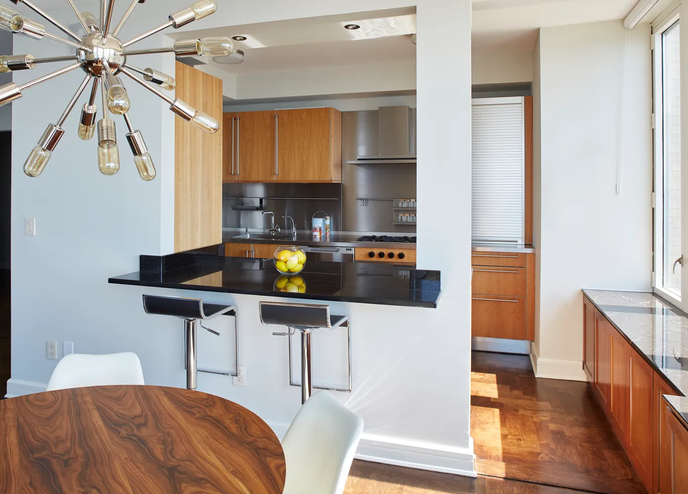 a kitchen with stainless steel appliances a sink a stove and a refrigerator