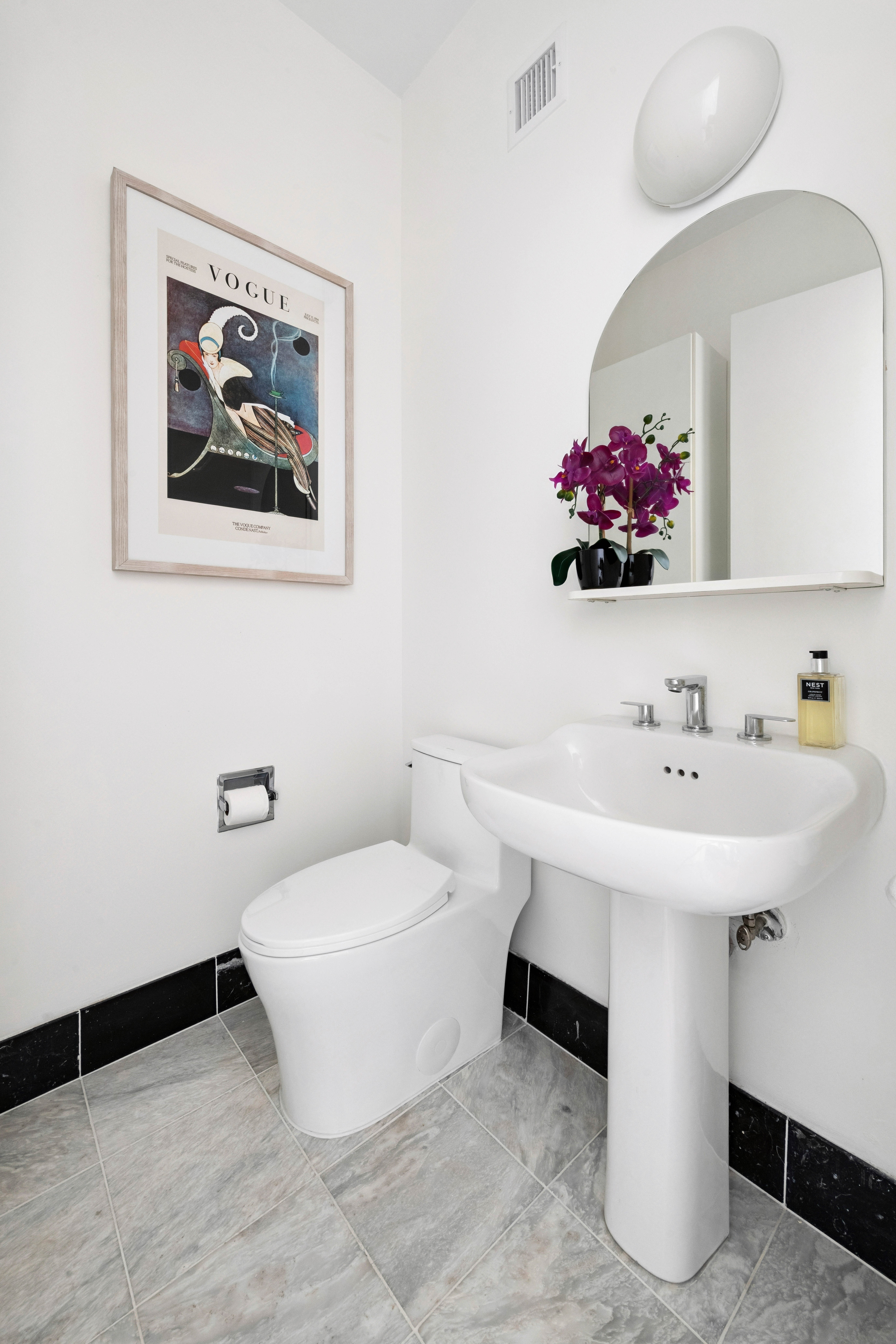 200 East 32nd Street, Unit 11D Manhattan, NY 10016 - Photo 12 of 19 a bathroom with a sink and a mirror
