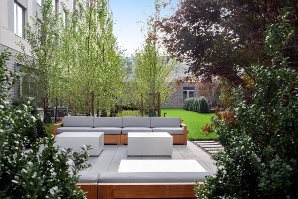 a view of a patio with couches and a fire pit