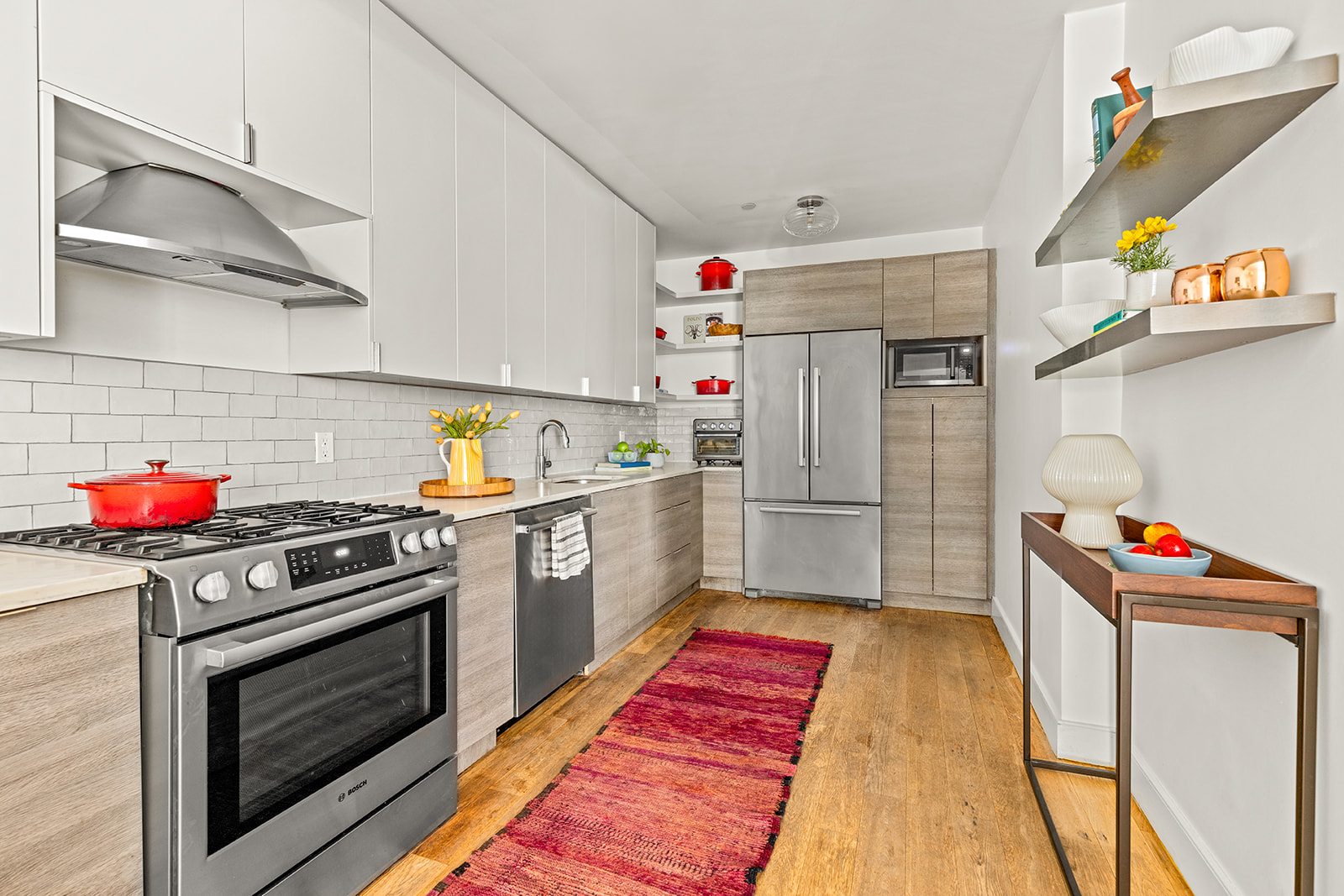 516 Classon Avenue, Unit 1B Brooklyn, NY 11238 - Photo 6 of 17 a kitchen with stainless steel appliances granite countertop a white stove top oven and sink