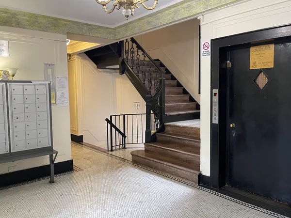a view of entryway with stairs and wooden floor