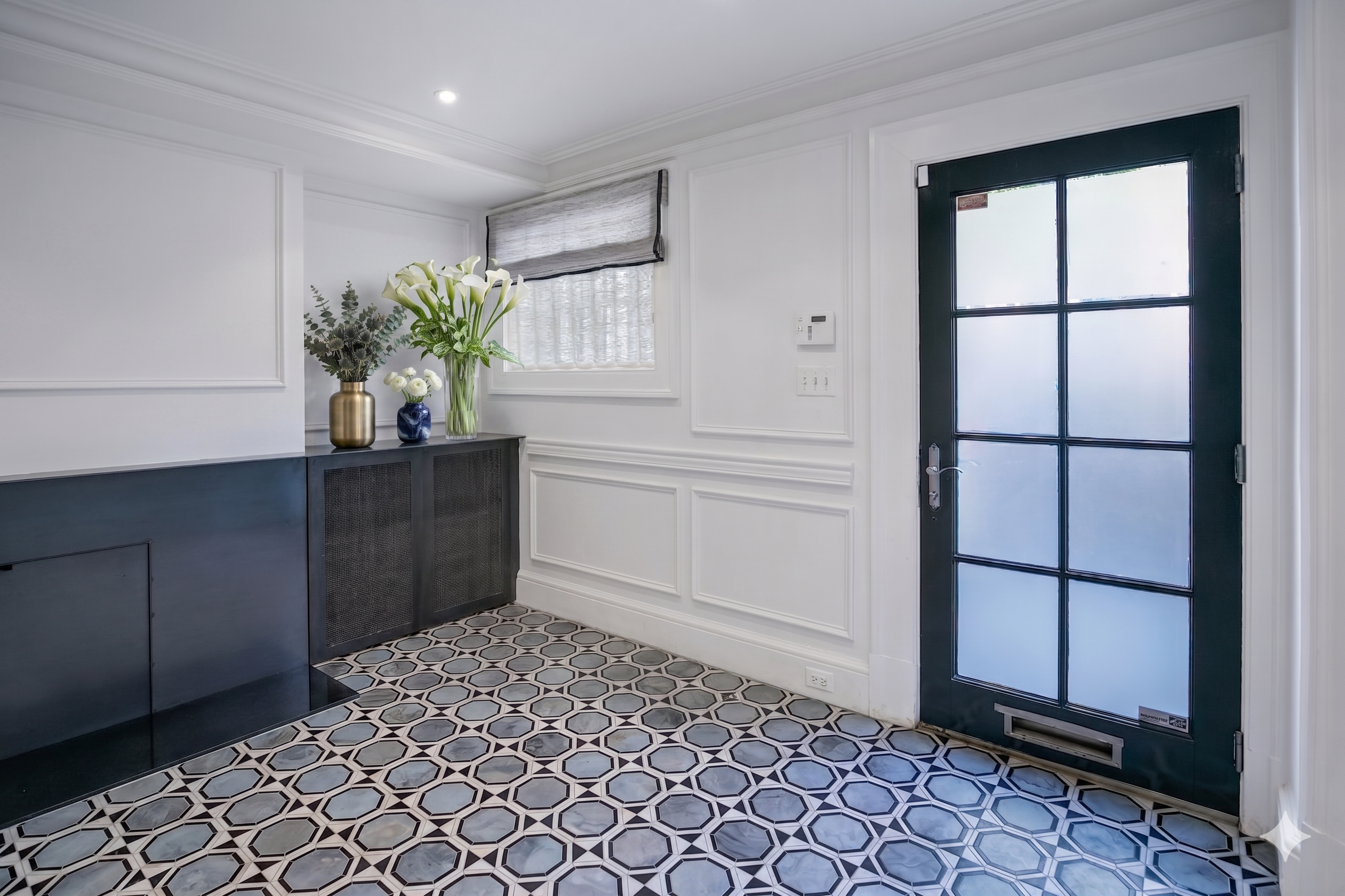 1832 Corcoran Street Northwest Washington, DC 20009 - Photo 3 of 29 a living room with a large window and potted plant
