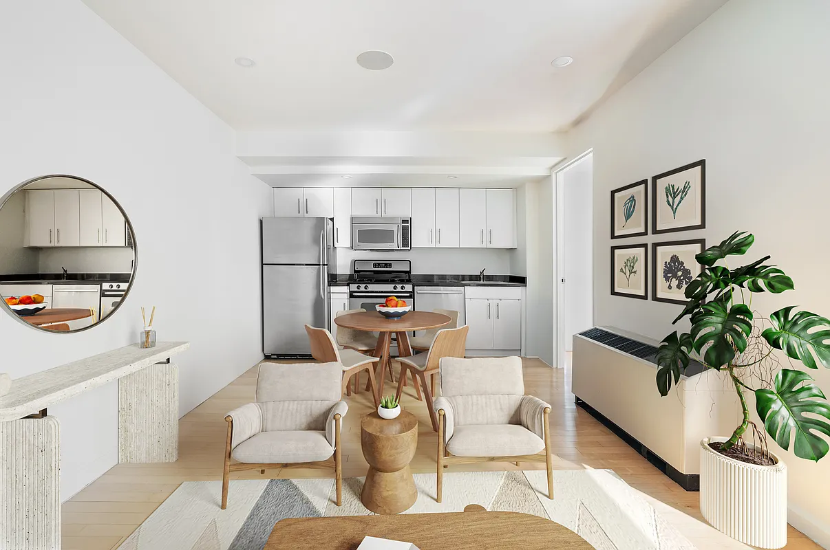 20 West Street, Unit 28F Manhattan, NY 10004 - Photo 3 of 18 a living room with furniture and a potted plant