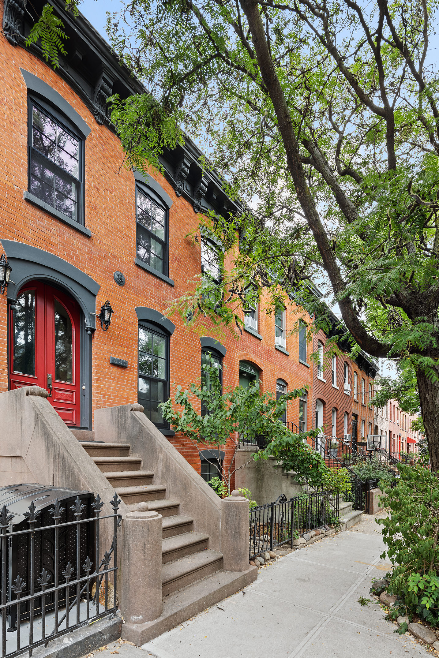 439 Sackett Street Brooklyn, NY 11231 - Photo 2 of 25 a front view of a multi story residential apartment building with a yard
