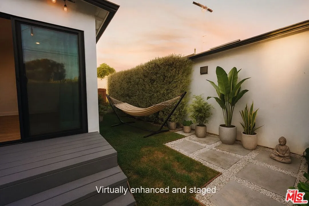 a balcony with table and chairs