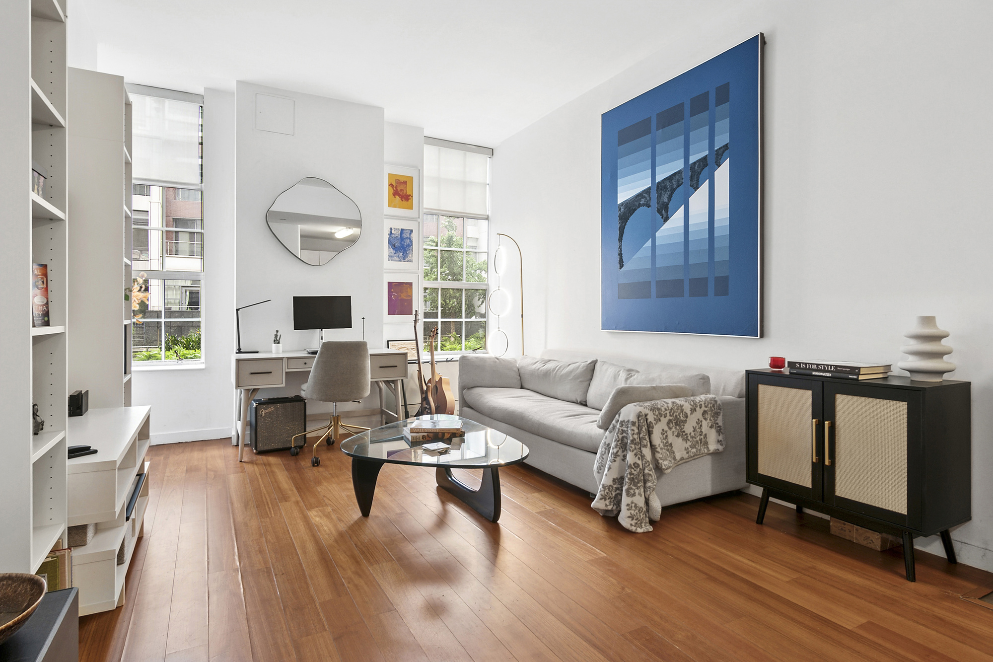 184 Kent Avenue, Unit D101 Brooklyn, NY 11249 - Photo 1 of 8 a living room with furniture and wooden floor