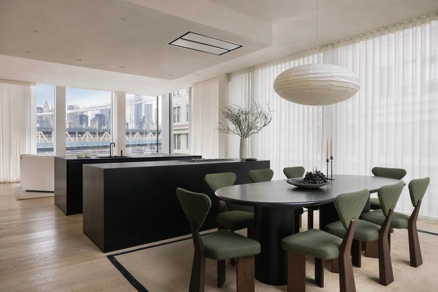 a dining room with furniture and wooden floor