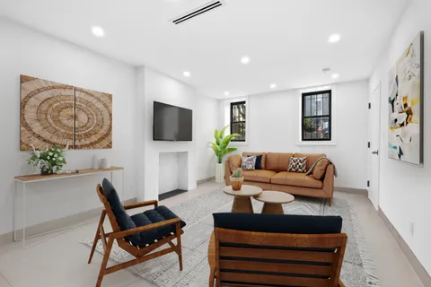 a kitchen with stainless steel appliances a sink dishwasher a stove and a microwave oven with cabinets