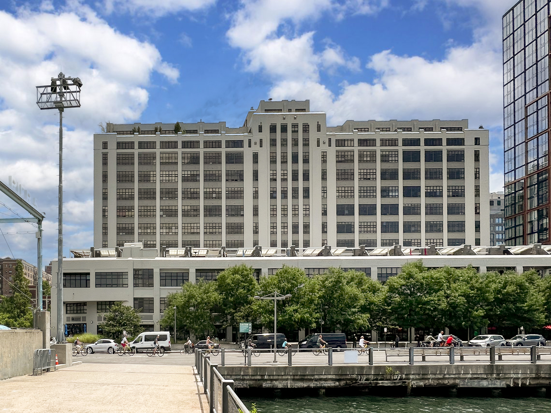 360 Furman Street, Unit 701 Brooklyn, NY 11201 - Photo 10 of 14 a front view of a building with garden