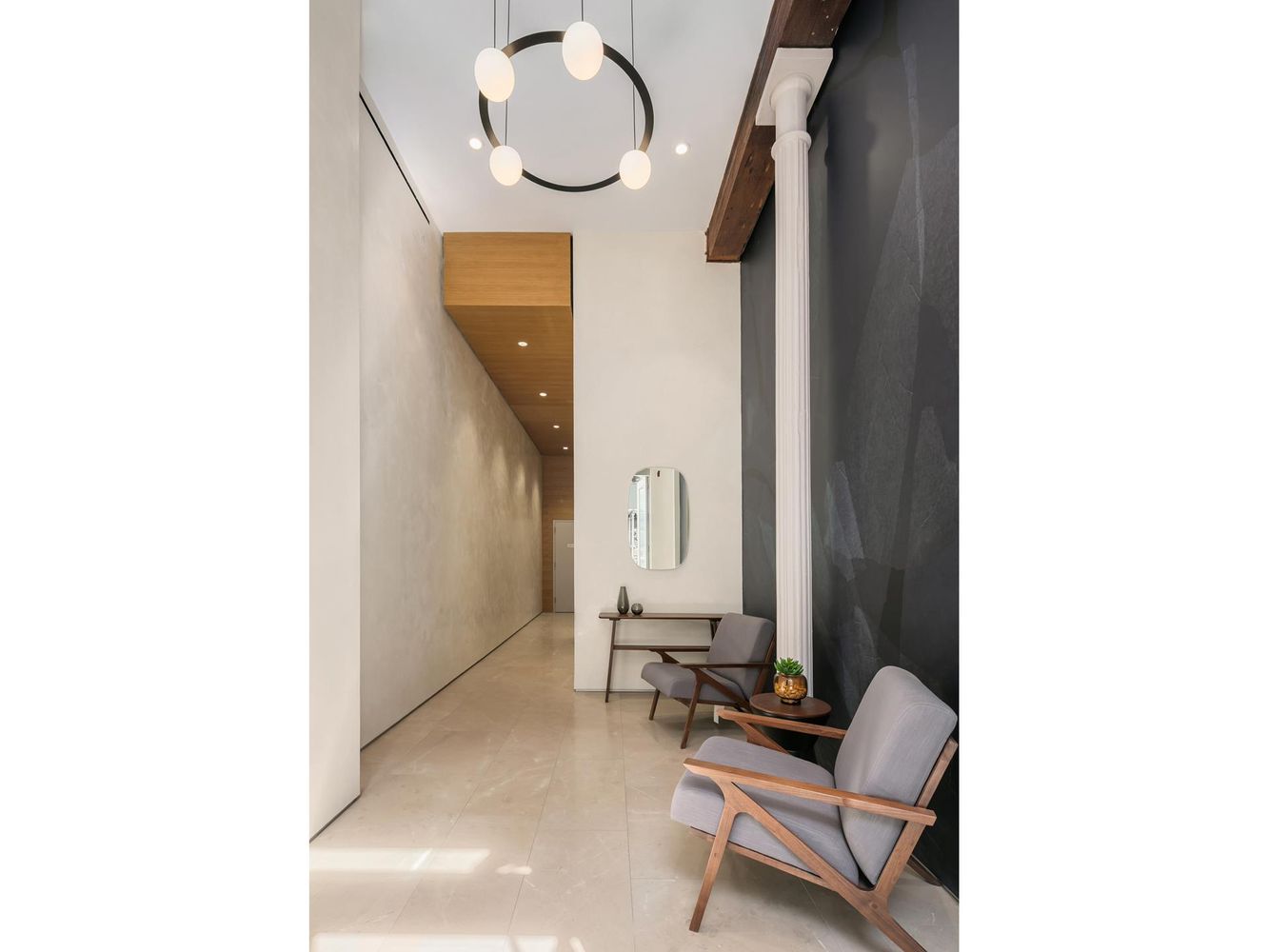 66 Reade Street, Unit TH Manhattan, NY 10007 - Photo 17 of 18 a living room with furniture and a mirror