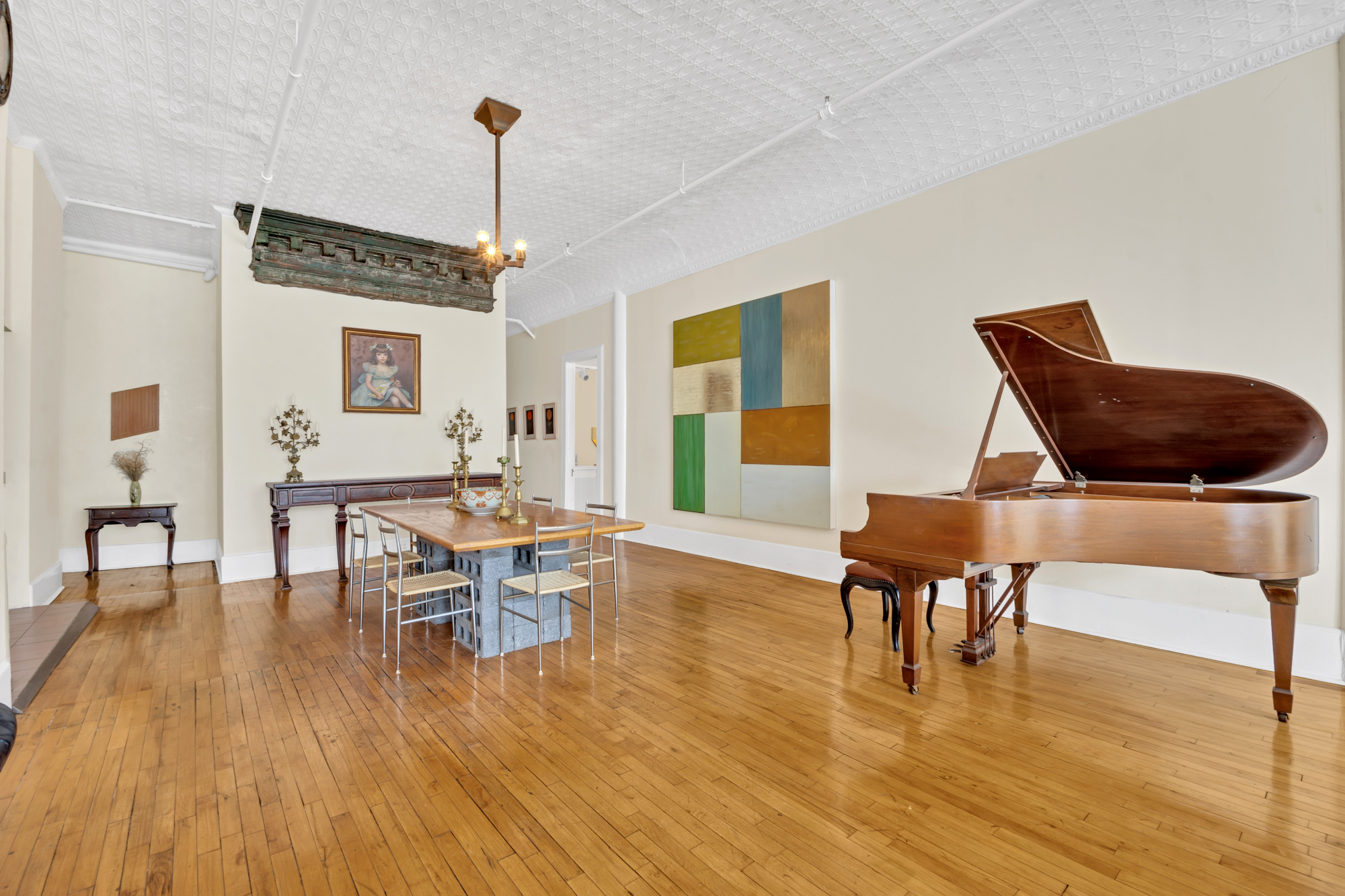 69 Wooster Street, Unit 3 Manhattan, NY 10012 - Photo 4 of 22 a living room with furniture and a wooden floor
