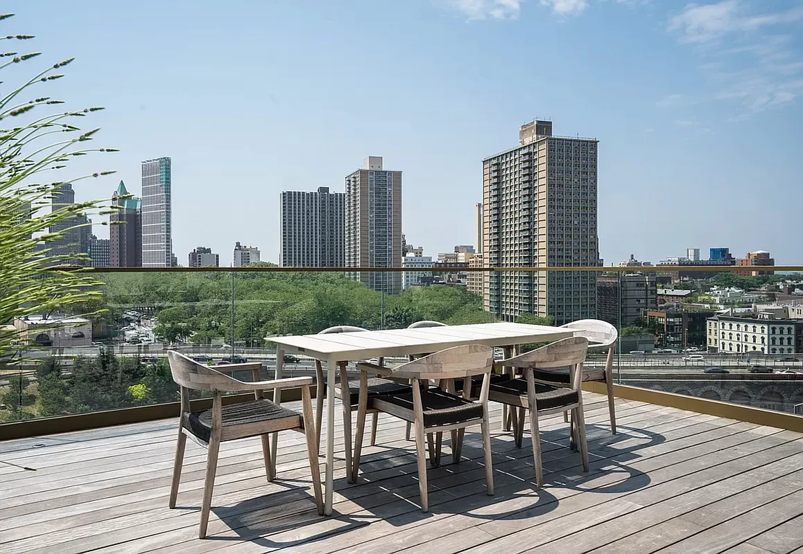 98 Front Street, Unit PH Brooklyn, NY 11201 - Photo 24 of 26 a patio with table and chairs