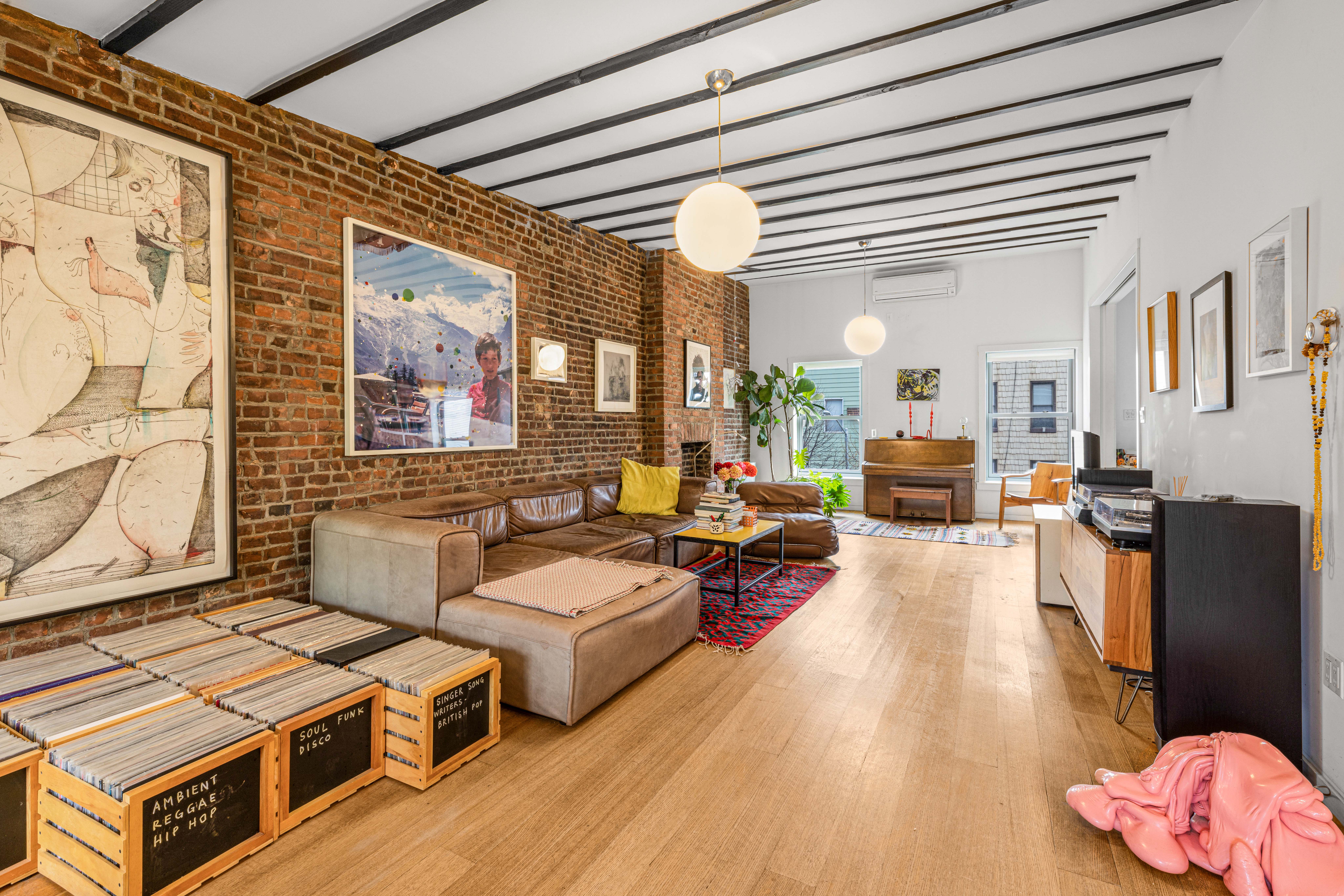 209 Calyer Street, Unit 2 Brooklyn, NY 11222 - Photo 11 of 17 a living room with patio furniture and a wooden floor