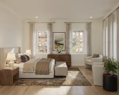 a spacious bedroom with a large bed and a couch