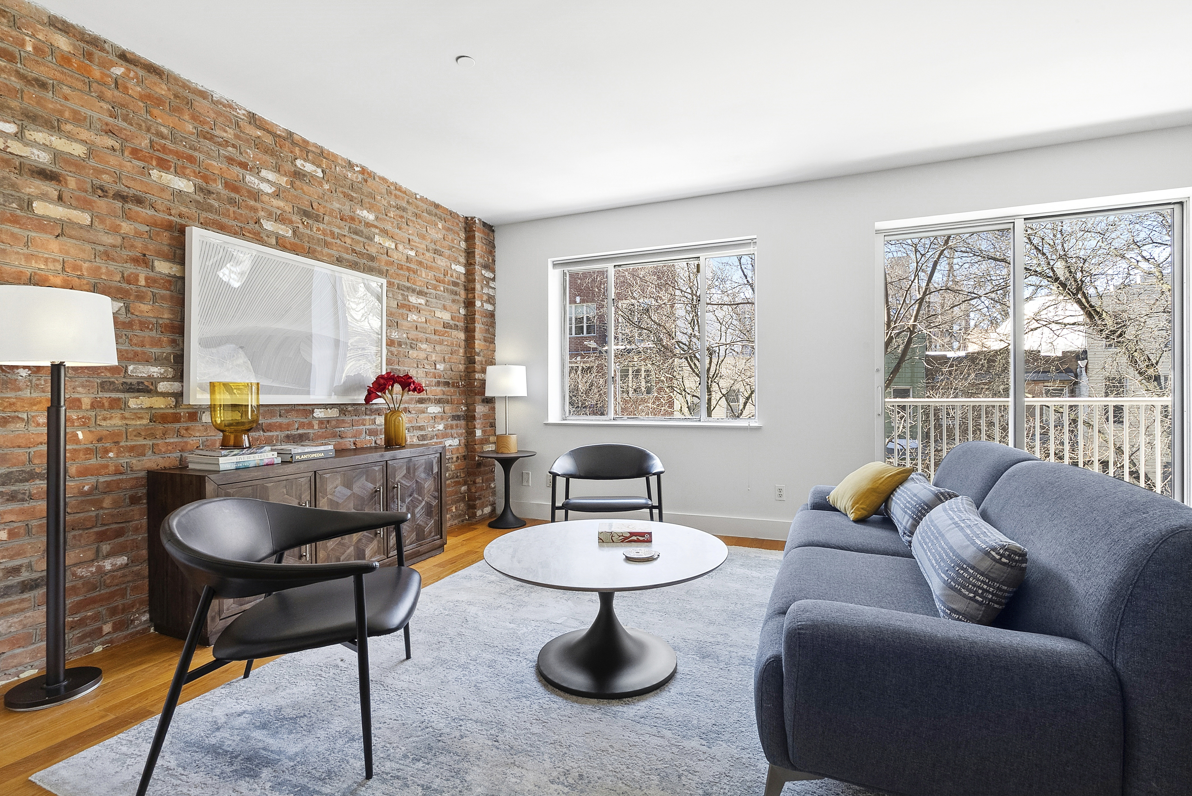 201 Spencer Street, Unit 3A Brooklyn, NY 11205 - Photo 3 of 11 a living room with furniture and a large window