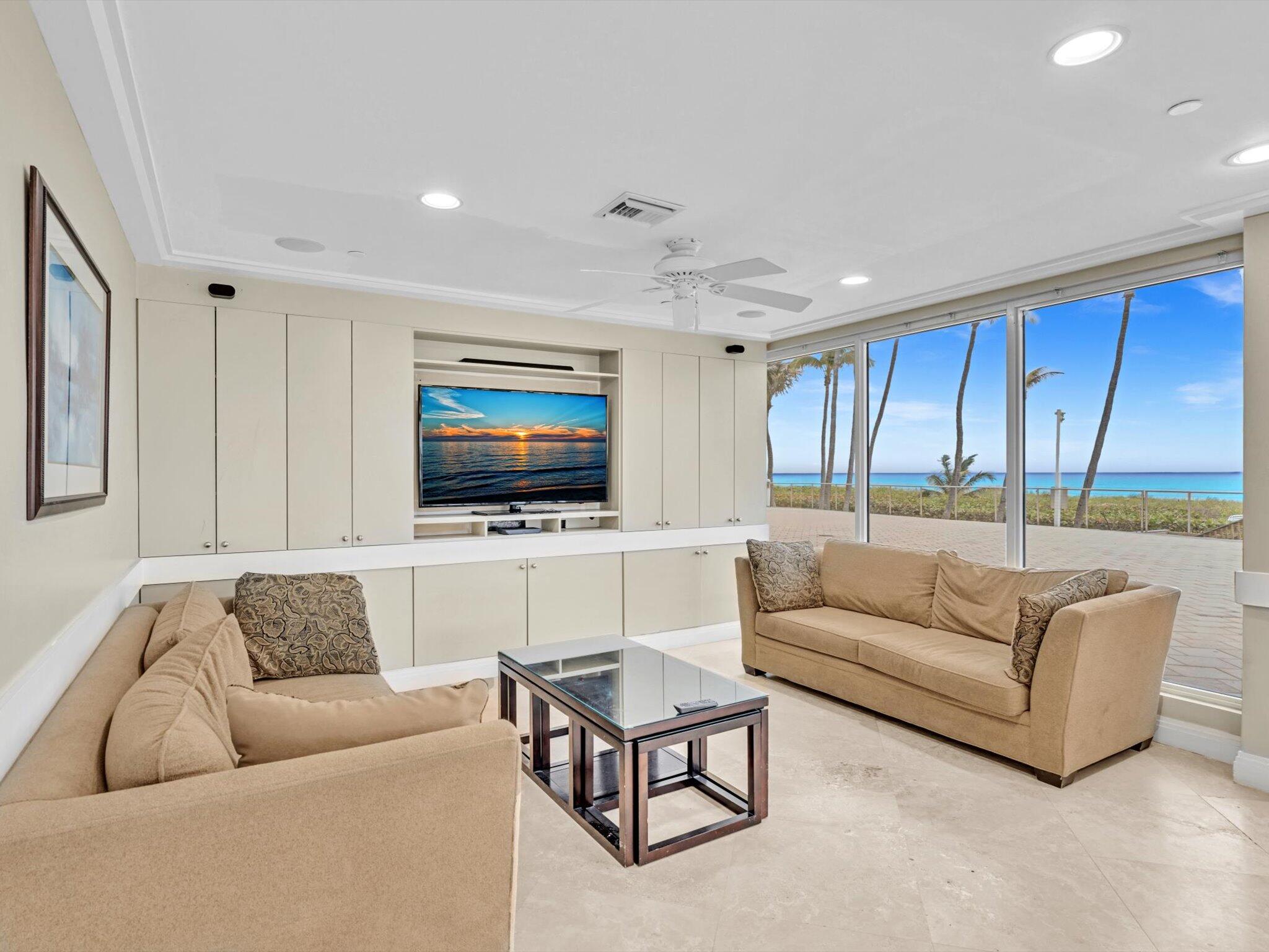 3000 South Ocean Boulevard, Unit 1504 Boca Raton, FL 33432 - Photo 43 of 64 a living room with furniture and a flat screen tv