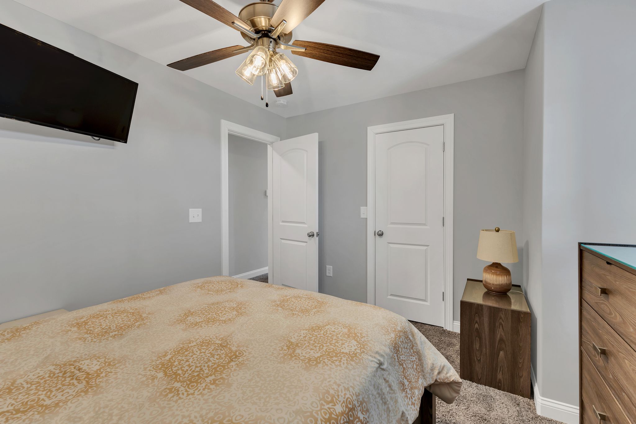 1484 Overlook Point Clarksville, TN 37043 - Photo 43 of 53 a bedroom with a large bed and a flat tv screen on a dresser