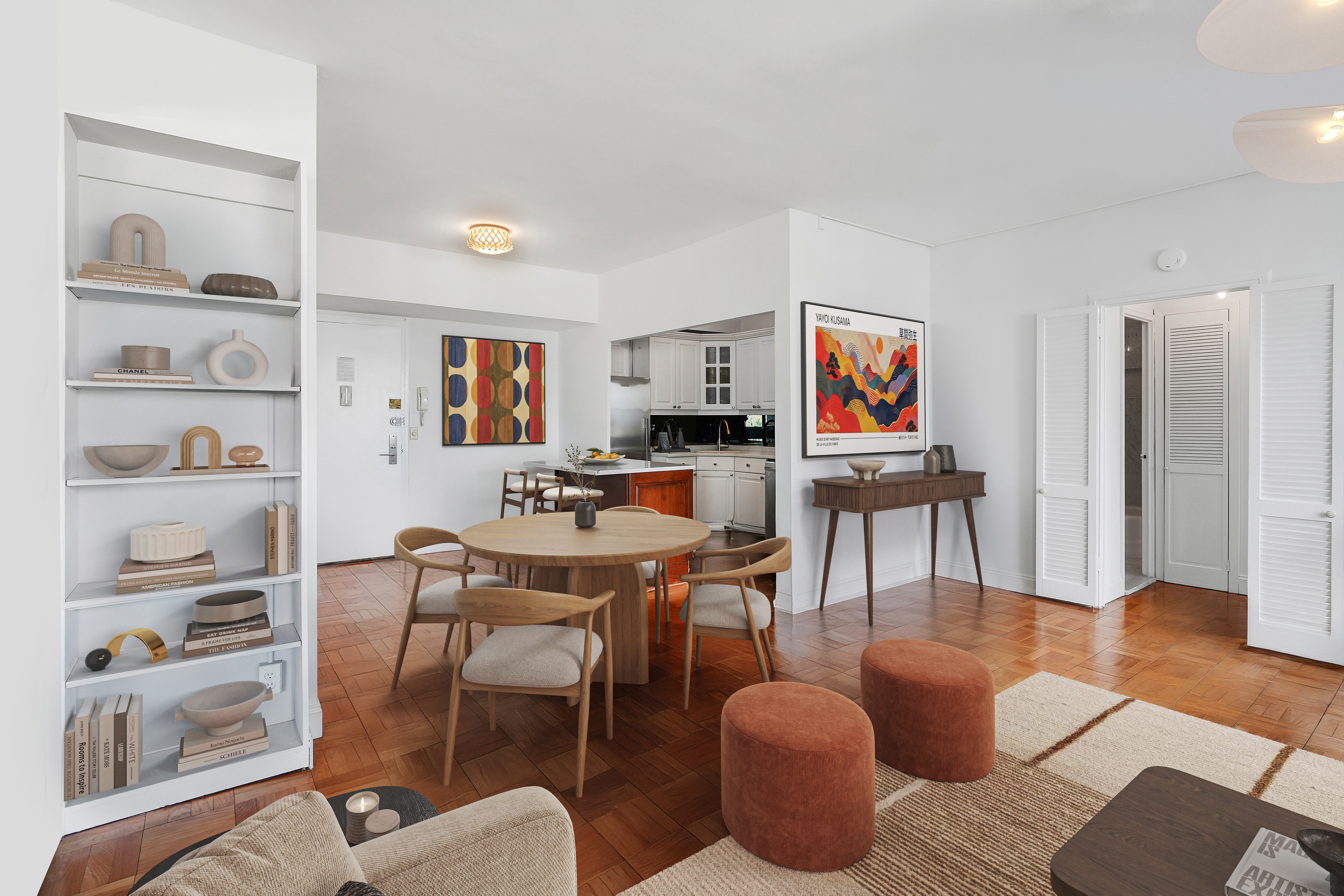 201 East 21st Street, Unit 20G Manhattan, NY 10010 - Photo 5 of 10 a living room with furniture a rug and a bookshelf