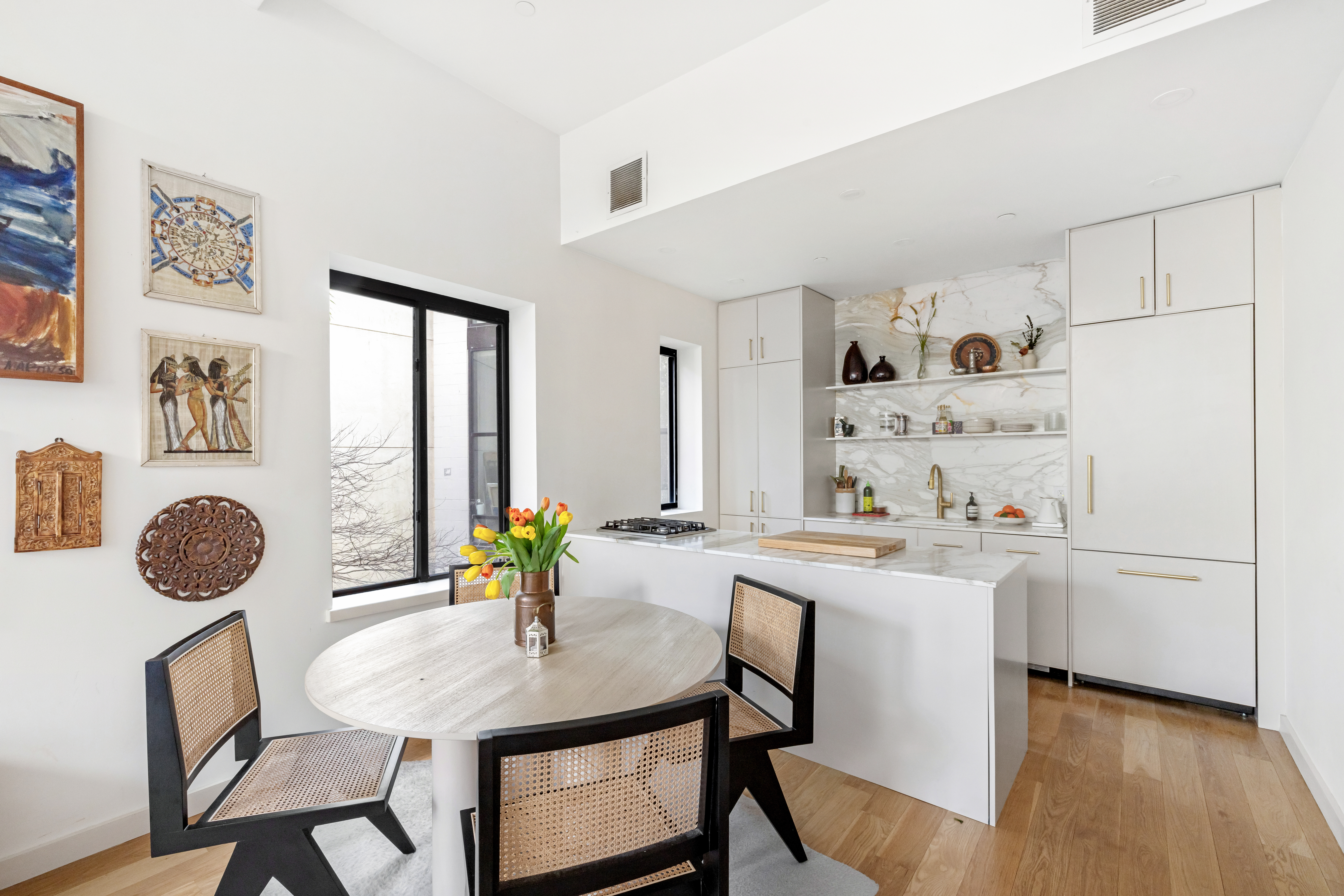 735 Dean Street, Unit 2B Brooklyn, NY 11238 - Photo 5 of 11 a view of a dining room with furniture and a potted plant