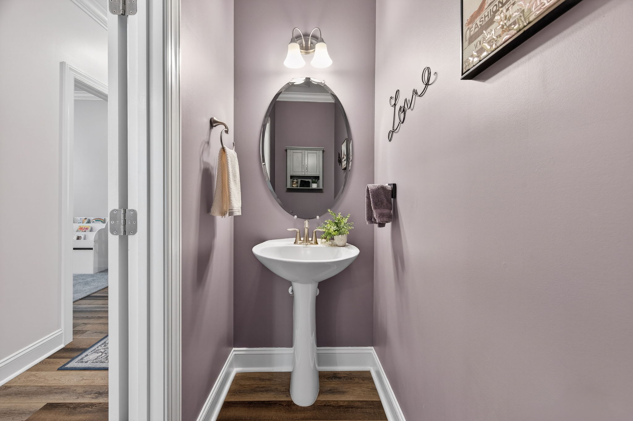 118 Mahogany Run Raleigh, NC 27610 - Photo 38 of 43 a bathroom with a sink and a mirror