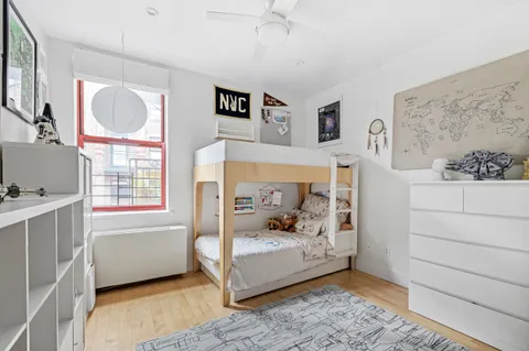 a room that has a bed and a window