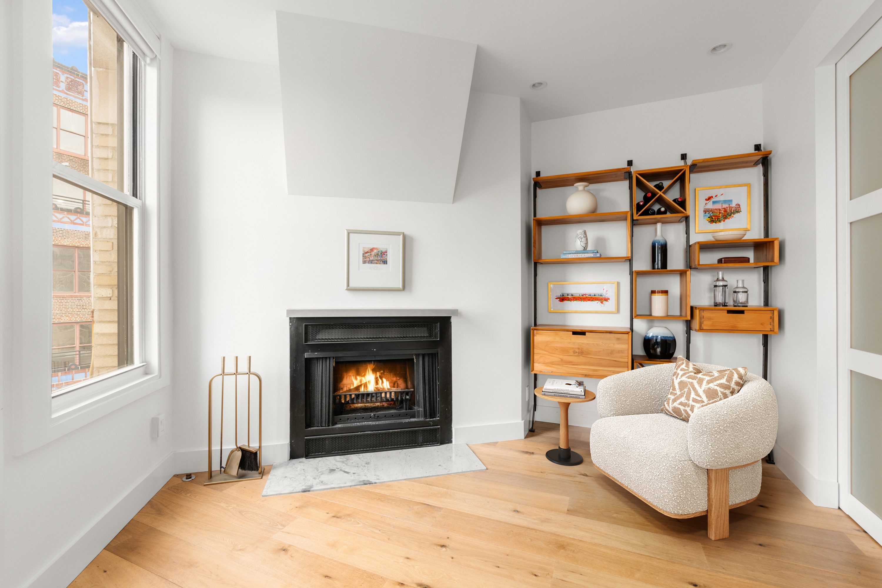 425 Park Avenue South, Unit 20D Manhattan, NY 10016 - Photo 2 of 7 a living room with furniture and a fireplace
