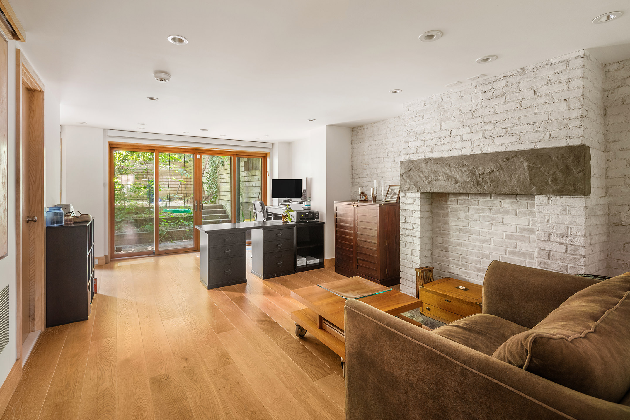 137 St Felix Street Brooklyn, NY 11217 - Photo 5 of 18 a living room with furniture a large window with kitchen view