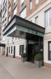 a view of a building with a potted plant