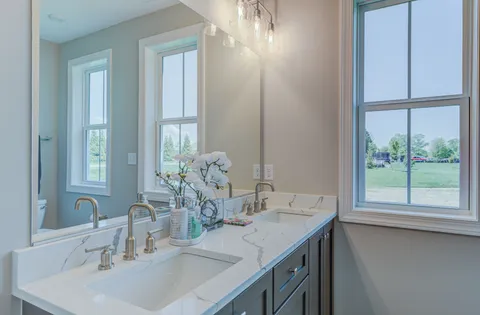 a bathroom with a sink and a large mirror